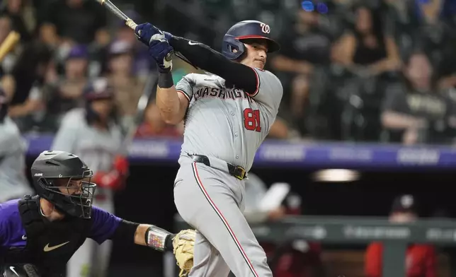 Washington Nationals' Drew Millas watches his double off Colorado Rockies relief pitcher Nick Mears during the ninth inning of a baseball game Friday, June 21, 2024, in Denver. (AP Photo/David Zalubowski)