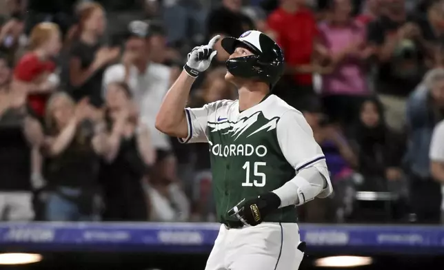 Colorado Rockies' Hunter Goodman celebrates his solo home run against the Washington Nationals during the seventh inning of a baseball game Saturday, June 22, 2024, in Denver. (AP Photo/Geneva Heffernan)