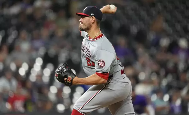 Washington Nationals relief pitcher Tanner Rainey works against the Colorado Rockies during the ninth inning of a baseball game Friday, June 21, 2024, in Denver. (AP Photo/David Zalubowski)