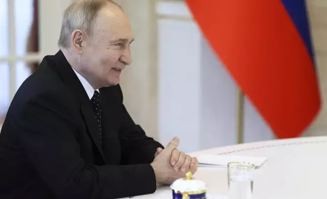 Russian President Vladimir Putin smiles as he talks with North Korea's leader Kim Jong Un during their tete-a-tete meeting in Pyongyang, North Korea, on Wednesday, June 19, 2024. (Gavriil Grigorov, Sputnik, Kremlin Pool Photo via AP)