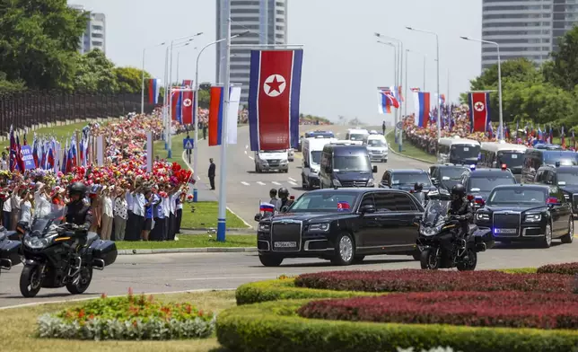 Motorcade with Russian President Vladimir Putin and North Korea's leader Kim Jong Un roll in the Kim Il Sung Square in Pyongyang, North Korea, on Wednesday, June 19, 2024. (Gavriil Grigorov, Sputnik, Kremlin Pool Photo via AP)