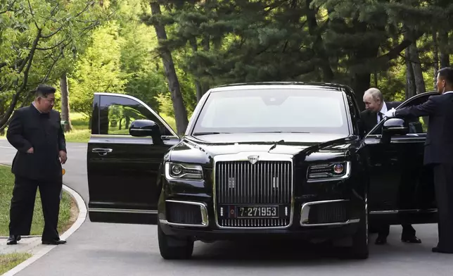 North Korea's leader Kim Jong Un, left, and Russian President Vladimir Putin prepare to drive a Russian Aurus limousine during their meeting in Pyongyang, North Korea, on Wednesday, June 19, 2024. (Gavriil Grigorov, Sputnik, Kremlin Pool Photo via AP)