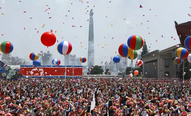North Korea's people attend the official welcome ceremony with Russian President Vladimir Putin and North Korea's leader Kim Jong Un in the Kim Il Sung Square in Pyongyang, North Korea, on Wednesday, June 19, 2024. (Vladimir Smirnov, Sputnik, Kremlin Pool Photo via AP)