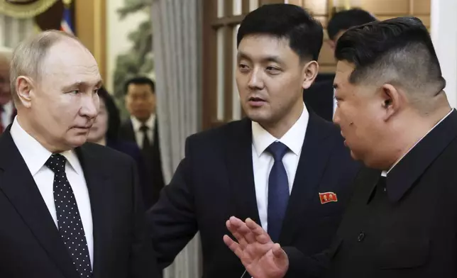 Russian President Vladimir Putin, left, listens to North Korea's leader Kim Jong Un during their meeting in Pyongyang, North Korea, on Wednesday, June 19, 2024. (Gavriil Grigorov, Sputnik, Kremlin Pool Photo via AP)