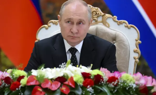Russian President Vladimir Putin attends a signing ceremony of the new partnership with North Korea's leader Kim Jong Un in Pyongyang, North Korea, on Wednesday, June 19, 2024. Putin and North Korean leader Kim Jong Un signed a new partnership that includes a vow of mutual aid if either country is attacked, during a Wednesday summit that came as both face escalating standoffs with the West. (Kristina Kormilitsyna, Sputnik, Kremlin Pool Photo via AP)