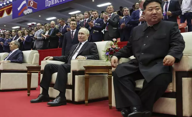 Russian President Vladimir Putin, center, North Korea's leader Kim Jong Un, right, and Russian Foreign Minister Sergey Lavrov, left, attend a gala concert in Pyongyang, North Korea, on Wednesday, June 19, 2024. (Gavriil Grigorov, Sputnik, Kremlin Pool Photo via AP)