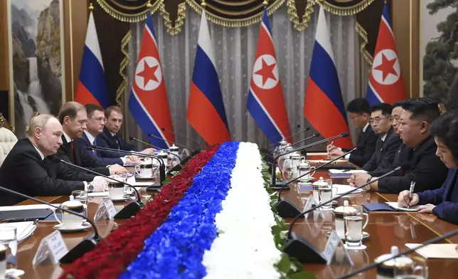 Russian President Vladimir Putin, left, and North Korea's leader Kim Jong Un, second right, attend the talks in Pyongyang, North Korea, Wednesday, June 19, 2024. (Kristina Kormilitsyna, Sputnik, Kremlin Pool Photo via AP)