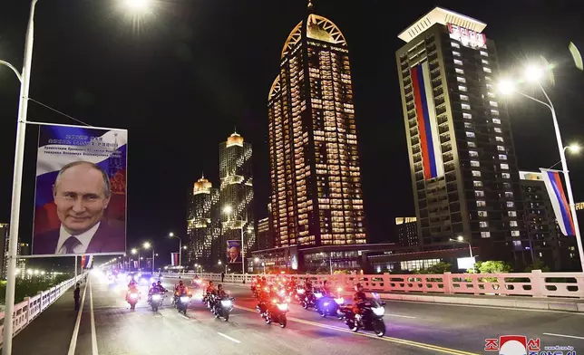 This photo provided Wednesday, June 19, 2024, by the North Korean government shows a motorcade with Russian President Vladimir Putin and North Korea's leader Kim Jong Un in Pyongyang, North Korea, early Wednesday, June 19. The content of this image is as provided and cannot be independently verified. Korean language watermark on image as provided by source reads: "KCNA" which is the abbreviation for Korean Central News Agency. (Korean Central News Agency/Korea News Service via AP)