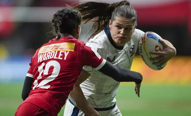 FILE - United States' Ilona Maher, right, runs the ball past Canada's Keyara Wardley during a Canada Sevens women's rugby match in Vancouver, British Columbia, Friday, March 3, 2023.The main task for Maher, the breakout social media star on TikTok at the Tokyo Olympics, is winning a medal in Paris. (Darryl Dyck/The Canadian Press via AP, File)