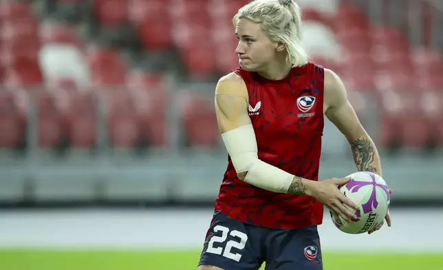 Sammy Sullivan of USA in action during HSBC rugby sevens series in Singapore, on May 4, 2024. The anthem played as Army officer Sammy Sullivan stood to attention and saluted beside her U.S. rugby teammates before a gold-medal game in Hong Kong against Olympic champion New Zealand. No prizes for guessing where her mind may have drifted to: Paris in July. (AP Photo/Suhaimi Abdullah)