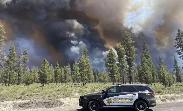 In this photo provided by the Deschutes County Sherriff's Office, smoke rises from a wildfire near La Pine, Oregon, Tuesday, June 25, 2024. Gusty winds fueled a rapidly growing wildfire just outside the central Oregon community of La Pine and prompted evacuations. (Sgt. Kyle Kalambach/Deschutes County Sherriff's Office via AP)