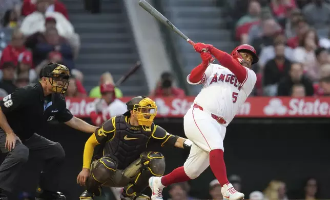 Los Angeles Angels designated hitter Willie Calhoun (5) singles during the fourth inning of a baseball game against the San Diego Padres in Anaheim, Calif., Monday, June 3, 2024. Luis Rengifo scored. (AP Photo/Ashley Landis)