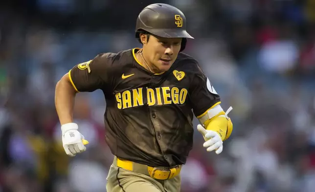 San Diego Padres' Ha-Seong Kim runs to first as he grounds out during the fifth inning of a baseball game against the Los Angeles Angels in Anaheim, Calif., Monday, June 3, 2024. (AP Photo/Ashley Landis)