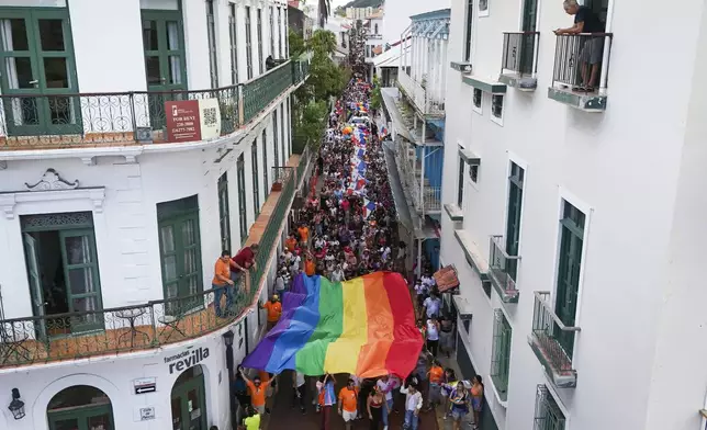 Revelers take part in a Gay Pride parade marking the culmination of LGBTQ+ Pride month, in Panama City, Saturday, June 29, 2024. (AP Photo/Matias Delacroix)