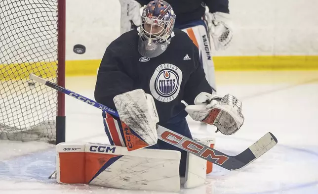 Edmonton Oilers goalie Stuart Skinner (74) makes a save during practice in Edmonton on Thursday June 20, 2024. The Edmonton Oilers take on the Florida Panthers in game 6 of the NHL Stanley Cup final on Friday.(Jason Franson /The Canadian Press via AP)