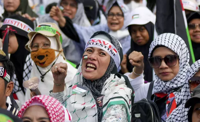 Protesters shout slogans during a rally in support of the Palestinians in Gaza in Jakarta, Indonesia, Sunday, June 9, 2024. (AP Photo/Tatan Syuflana)