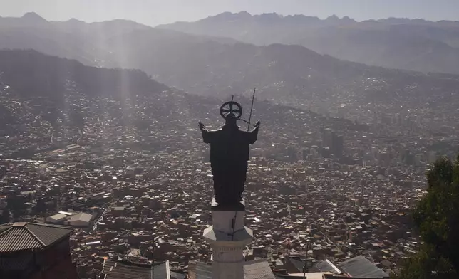 The statue of "Corazon de Jesus," or Heart of Jesus, stands in El Aldo, Bolivia, overlooking La Paz, Monday, June 10, 2024. (AP Photo/Juan Karita)