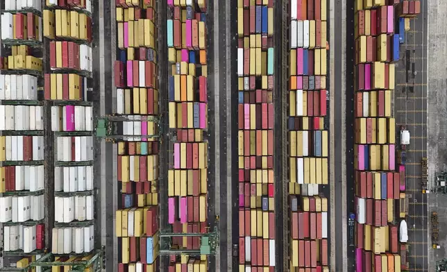 Cranes load and unload containers from cargo ships at Rodman Port, after Panama Canal authorities reported they will increase vessel transits through the interoceanic waterway following drought-related restrictions, in Panama City, June 13, 2024. (AP Photo/Matias Delacroix)