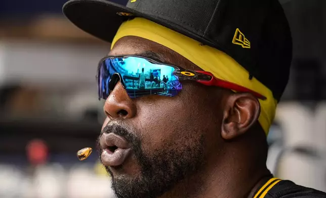 Pittsburgh Pirates outfielder Andrew McCutchen (22) sits in the dugout in the third inning of a baseball game against the Atlanta Braves, Saturday, June 29, 2024, in Atlanta. (AP Photo/Mike Stewart)