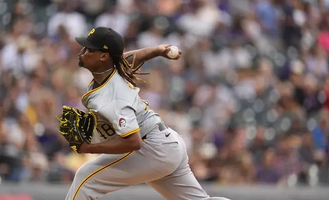 Pittsburgh Pirates relief pitcher Luis L. Ortiz works against the Colorado Rockies in the second inning of a baseball game Friday, June 14, 2024, in Denver. (AP Photo/David Zalubowski)