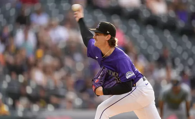 Colorado Rockies starting pitcher Ryan Feltner works against the Pittsburgh Pirates during the first inning of a baseball game Friday, June 14, 2024, in Denver. (AP Photo/David Zalubowski)