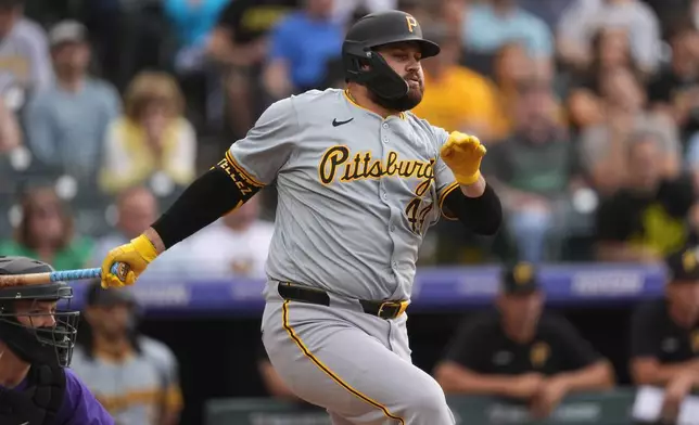 Pittsburgh Pirates' Rowdy Tellez watches a single off Colorado Rockies starting pitcher Ryan Feltner during the first inning of a baseball game Friday, June 14, 2024, in Denver. (AP Photo/David Zalubowski)
