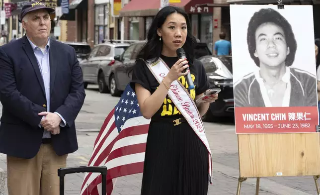 Miss Chinese Boston Sarah Chu speaks beside Boston City Councilor Ed Flynn during a remembrance ceremony for Vincent Chin in Chinatown, Sunday, June 23, 2024, in Boston. Over the weekend, vigils were held across the country to honor the memory of Chin, who was killed by two white men in 1982 in Detroit. (AP Photo/Michael Dwyer)