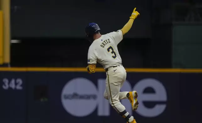 Milwaukee Brewers' Joey Ortiz celebrates after hitting a home run during the fifth inning of a baseball game against the Texas Rangers Tuesday, June 25, 2024, in Milwaukee. (AP Photo/Morry Gash)