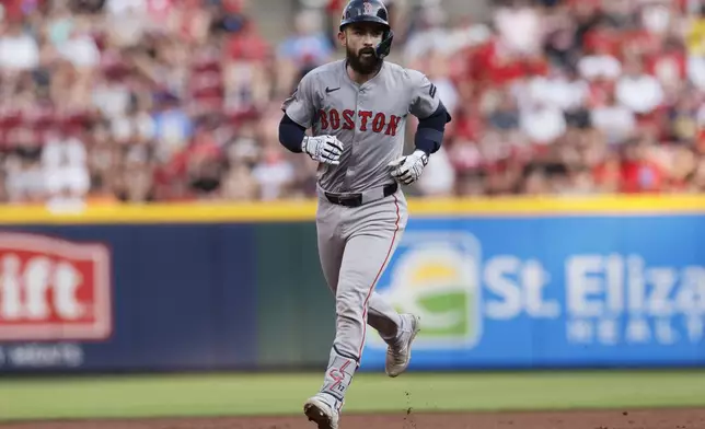 Boston Red Sox's Connor Wong runs the bases after hitting a home run against the Cincinnati Reds during the second inning of a baseball game Friday, June 21, 2024, in Cincinnati. (AP Photo/Jay LaPrete)
