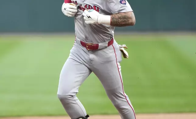 Boston Red Sox's Jarren Duran begins to celebrate his home run off Chicago White Sox starting pitcher Jake Woodford during the first inning of a baseball game Thursday, June 6, 2024, in Chicago. (AP Photo/Charles Rex Arbogast)