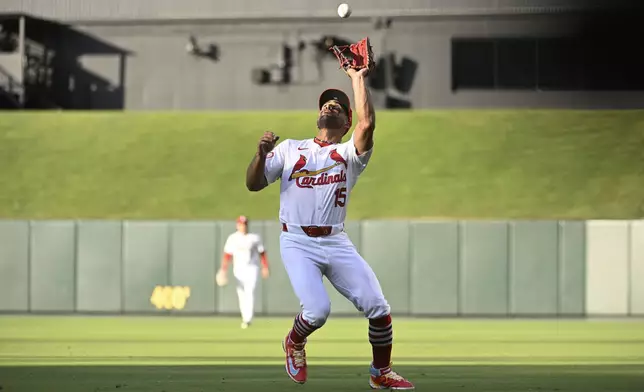 St. Louis Cardinals second baseman Jose Fermin catches a popup hit by Cincinnati Reds' Noelvi Marte during the first inning of a baseball game Thursday, June 27, 2024, in St. Louis. (AP Photo/Joe Puetz)