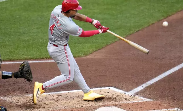 Cincinnati Reds' Santiago Espinal hits a two-run home run off Pittsburgh Pirates starting pitcher Bailey Falter during the fifth inning of a baseball game in Pittsburgh, Tuesday, June 18, 2024. (AP Photo/Gene J. Puskar)