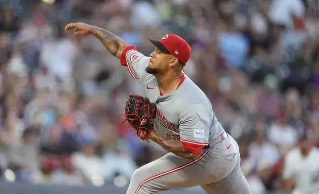 Cincinnati Reds starting pitcher Frankie Montas works against the Colorado Rockies in the fifth inning of a baseball game Tuesday, June 4, 2024, in Denver. (AP Photo/David Zalubowski)