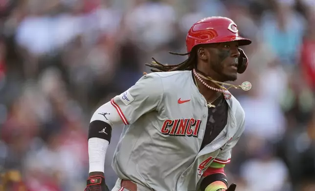 Cincinnati Reds' Elly De La Cruz runs the bases after hitting a solo home run off Colorado Rockies starting pitcher Ty Blach during the third inning of a baseball game Tuesday, June 4, 2024, in Denver. (AP Photo/David Zalubowski)
