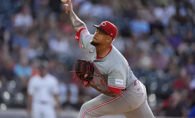 Cincinnati Reds starting pitcher Frankie Montas works against the Colorado Rockies during the first inning of a baseball game Tuesday, June 4, 2024, in Denver. (AP Photo/David Zalubowski)