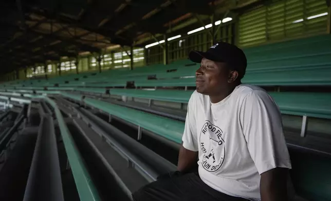 Jabreil Weir, head grounds keeper, poses for a photograph at Rickwood Field, Monday, June 10, 2024, in Birmingham, Ala. Rickwood Field, known as one of the oldest professional ballpark in the United States and former home of the Birmingham Black Barons of the Negro Leagues, will be the site of a special regular season game between the St. Louis Cardinals and San Francisco Giants on June 20, 2024. (AP Photo/Brynn Anderson)