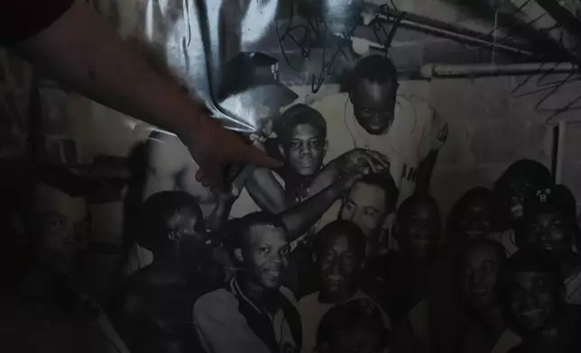 A production member shows the Associated Press an image of former baseball player Willie Mays and other former Birmingham Black Barrons players at Rickwood Field, Monday, June 10, 2024, in Birmingham, Ala. Mays played for the Birmingham Black Barons at the start of his career. Rickwood Field, known as one of the oldest professional ballpark in the United States and former home of the Birmingham Black Barons of the Negro Leagues, will be the site of a special regular season game between the St. Louis Cardinals and San Francisco Giants on June 20, 2024. (AP Photo/Brynn Anderson)