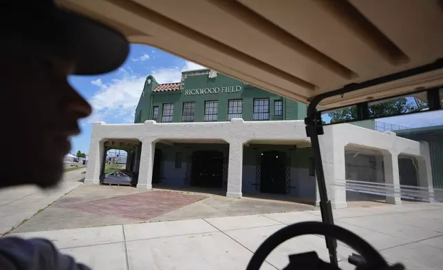 A person drives a golf cart through a construction site at Rickwood Field, Monday, June 10, 2024, in Birmingham, Ala. Rickwood Field, known as one of the oldest professional ballpark in the United States and former home of the Birmingham Black Barons of the Negro Leagues, will be the site of a special regular season game between the St. Louis Cardinals and San Francisco Giants on June 20, 2024. (AP Photo/Brynn Anderson)