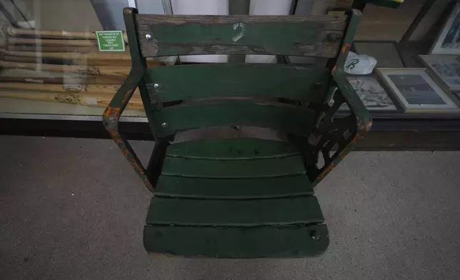 An antique chair, formally used inside Rickwood Field, is on display in a shop, Monday, June 10, 2024, in Birmingham, Ala. Rickwood Field, known as one of the oldest professional ballpark in the United States and former home of the Birmingham Black Barons of the Negro Leagues, will be the site of a special regular season game between the St. Louis Cardinals and San Francisco Giants on June 20, 2024. (AP Photo/Brynn Anderson)