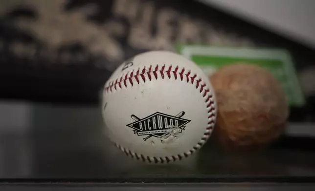 A Rickwood Field baseball is on display in a shop, Monday, June 10, 2024, in Birmingham, Ala. Rickwood Field, known as one of the oldest professional ballpark in the United States and former home of the Birmingham Black Barons of the Negro Leagues, will be the site of a special regular season game between the St. Louis Cardinals and San Francisco Giants on June 20, 2024. (AP Photo/Brynn Anderson)