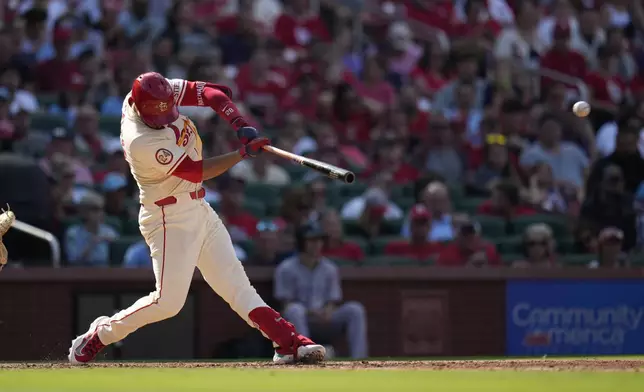 St. Louis Cardinals' Nolan Arenado hits an RBI single during the sixth inning of a baseball game against the Colorado Rockies Saturday, June 8, 2024, in St. Louis. (AP Photo/Jeff Roberson)