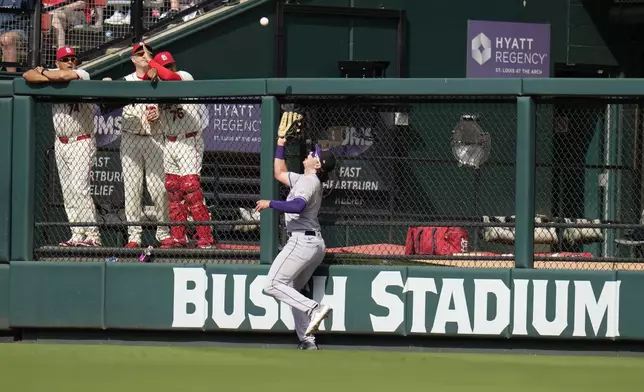 Colorado Rockies right fielder Michael Toglia catches a fly ball by St. Louis Cardinals' Brendan Donovan during the fifth inning of a baseball game Saturday, June 8, 2024, in St. Louis. (AP Photo/Jeff Roberson)