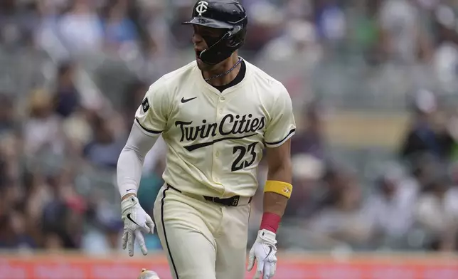 Minnesota Twins' Royce Lewis (23) celebrates after hitting a two-run home run during the sixth inning of a baseball game against the Colorado Rockies,Wednesday, June 12, 2024, in Minneapolis. (AP Photo/Abbie Parr)