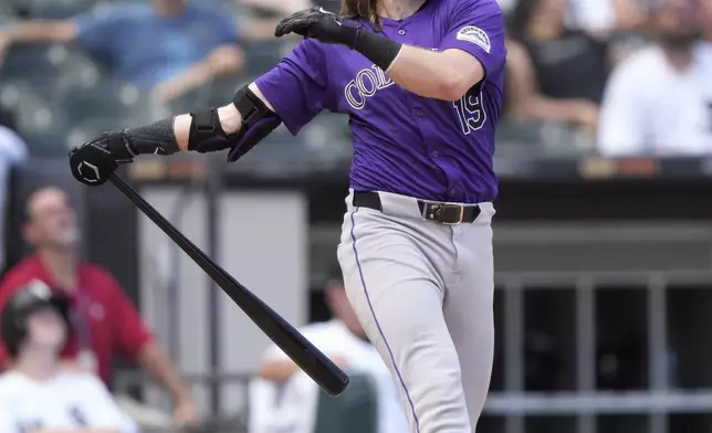Colorado Rockies' Charlie Blackmon watches his popup during the eighth inning of a baseball game against the Chicago White Sox, Saturday, June 29, 2024, in Chicago. (AP Photo/Charles Rex Arbogast)