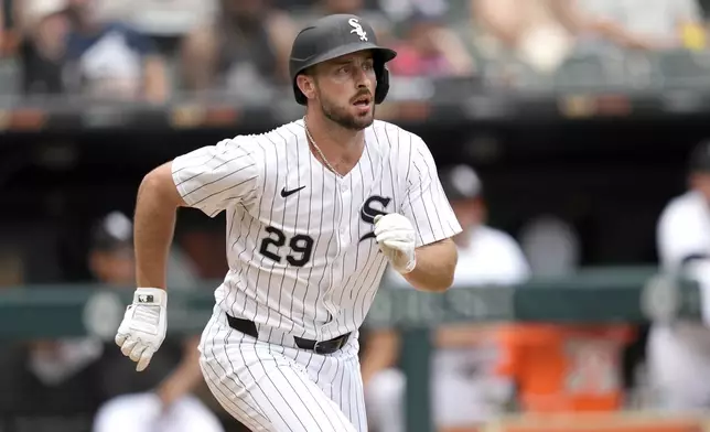 Chicago White Sox's Paul DeJong watches his RBI single during the eighth inning of a baseball game against the Colorado Rockies, Saturday, June 29, 2024, in Chicago. (AP Photo/Charles Rex Arbogast)