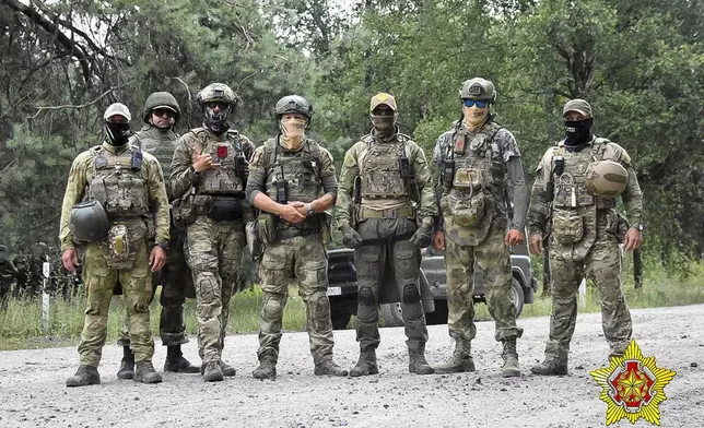 FILE - In this photo released by Belarus' Defense Ministry on July 20, 2023, Belarusian soldiers and mercenaries from Russia’s Wagner private military company pose for a photo amid maneuvers at a firing range near the border city of Brest, Belarus. On June 24, 2023, the private military company ended a brief rebellion against the Russian Defense Ministry that Wagner chief Yevgeny Prigozhin accused of failing to supply his forces in Ukraine. (Belarus' Defense Ministry via AP, File)