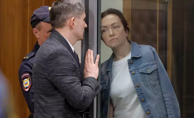 FILE - Alsu Kurmasheva, an editor for the U.S. government-funded Radio Free Europe/Radio Liberty's Tatar-Bashkir service, listens to her lawyer during a court hearing in Kazan, Russia, on May 31, 2024. Kurmasheva, a dual U.S.-Russian national, was arrested in October 2023 in her hometown of Kazan. The Prague-based editor was visiting her ailing mother. She faces multiple charges, including not self-reporting as a "foreign agent" and spreading false information about the Russian military. (AP Photo, File)