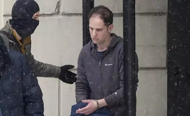 FILE - Wall Street Journal reporter Evan Gershkovich is escorted from court in Moscow, Russia, on Jan. 26, 2024. The 32-year-old journalist faces trial Wednesday, June 26, on espionage charges that he, his employer and the U.S. government deny. He was detained in March 2023 while reporting in the city of Yekaterinburg and accused of spying. (AP Photo/Alexander Zemlianichenko, File)