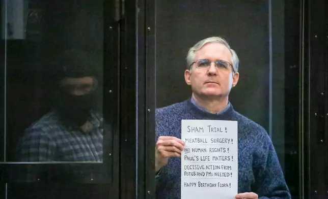 FILE - Paul Whelan, a former U.S. Marine who was arrested for alleged spying, listens to the verdict in a courtroom in Moscow, Russia, on June 15, 2020. The 54-year-old corporate security executive from Michigan was arrested in 2018 in Moscow where he was attending a friend's wedding, convicted two years later of espionage, and sentenced to 16 years in prison. He maintains his innocence, saying the charges were fabricated. (Sofia Sandurskaya, Moscow News Agency photo via AP, File)