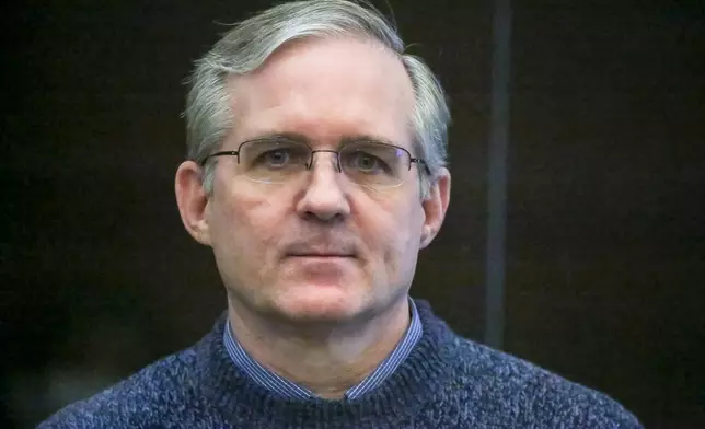 FILE - Paul Whelan, a former U.S. Marine who was arrested on espionage charges, listens to the verdict in court in Moscow, Russia, on June 15, 2020. The 54-year-old corporate security executive from Michigan was arrested in 2018 in Moscow where he was attending a friend's wedding, convicted two years later of espionage, and sentenced to 16 years in prison. He maintains his innocence, saying the charges were fabricated. (Sofia Sandurskaya, Moscow News Agency photo via AP, File)